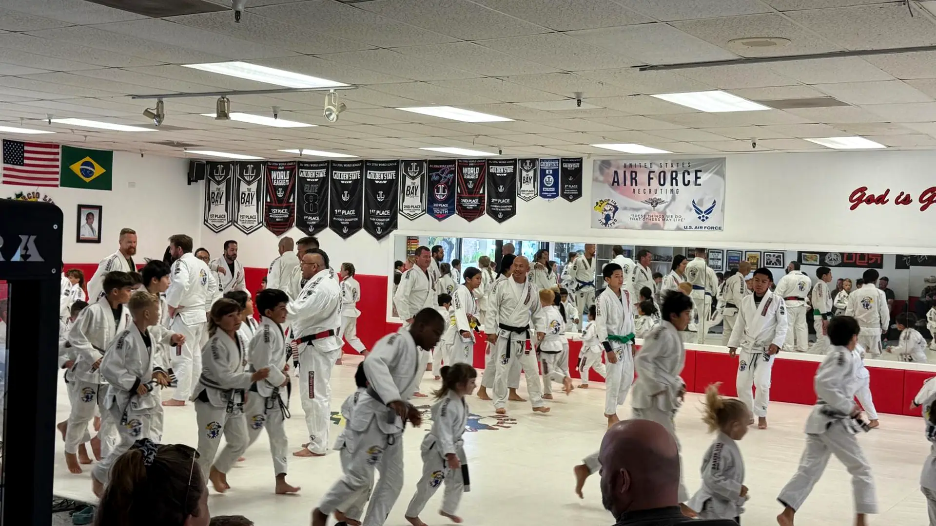 A kids class warming up together on the mats
